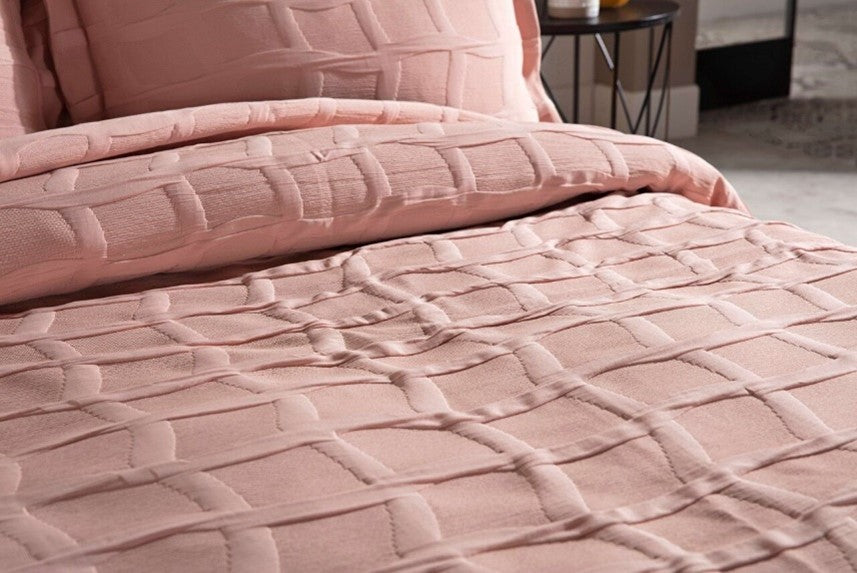 Pink bedspread set in king size, including a bed cover and two pillowcases.